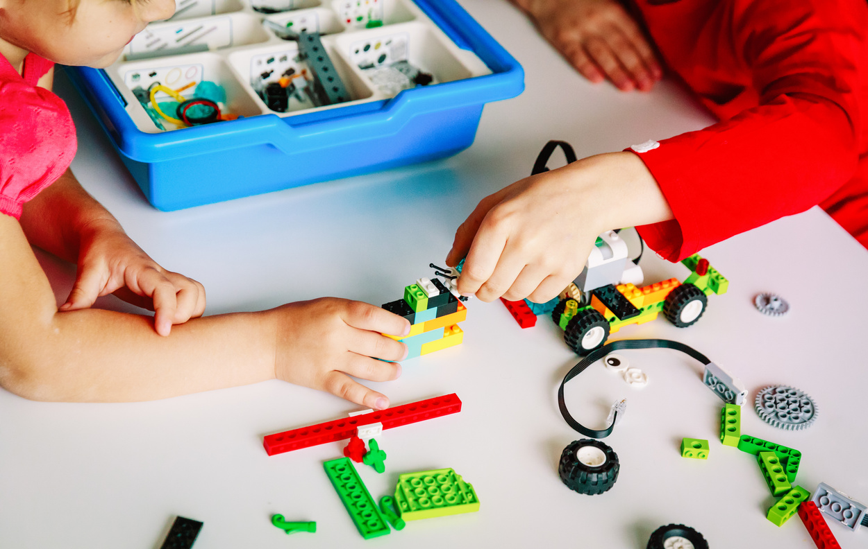 kids building robot at robotic technology school lesson