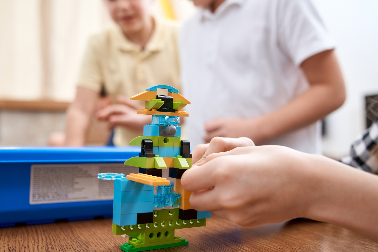 Child Making a Robot out of a Building Kit 