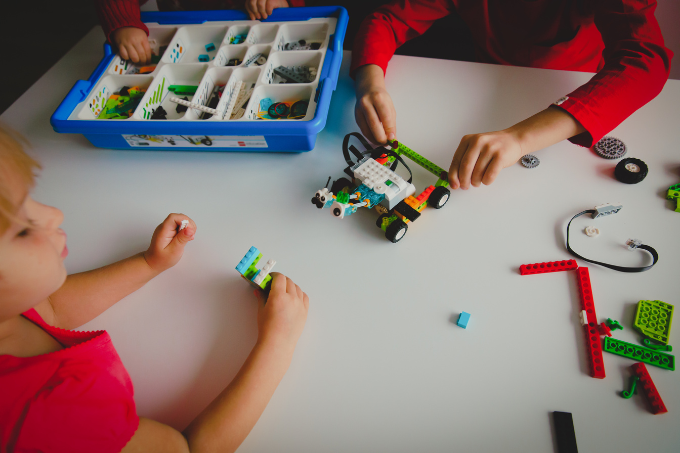 kids building robot at robotic technology school lesson